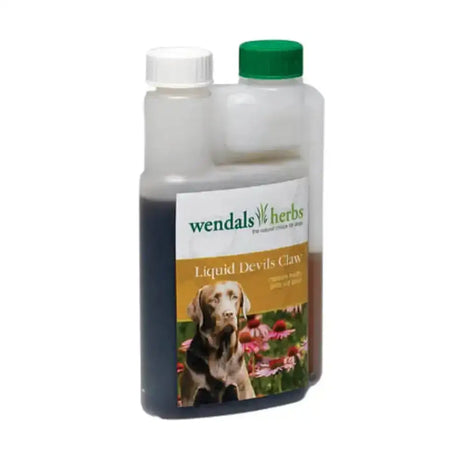 A clear plastic bottle with green cap containing dark wendals dog liquid devils claw root from native african plant