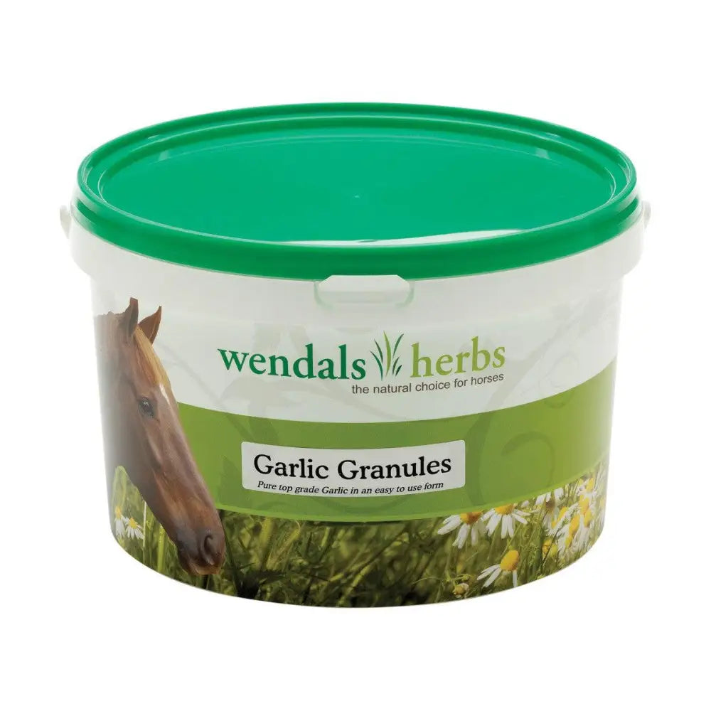 Green-lidded white plastic container of wendals garlic granules for horse supplements with horse and daisies label