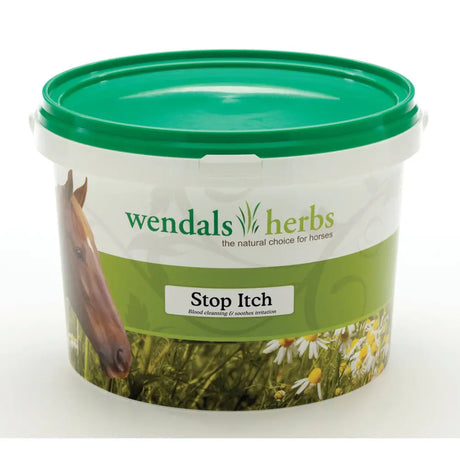 Green-lidded plastic tub of wendals stop itch horse supplements for skin irritations caused by natural herbs with horse and daisies label