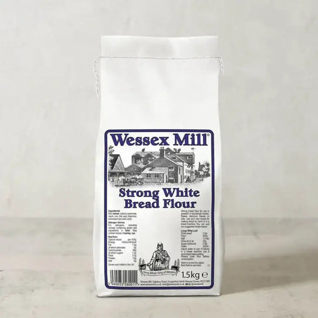 White paper bag of wessex mill strong white bread flour 1.5kg with blue black label and mill illustration