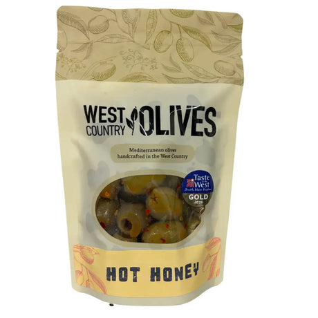 A cream-colored resealable pouch of west country hot honey olives 175g with a clear window showing mediterranean olives