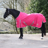 Bright pink whitaker 0g standard turnout rug with gray trim adjustable straps and small side logo