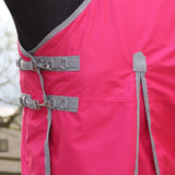 Bright pink whitaker 0g standard turnout rug pink with gray straps metal buckles and umbrella tail cover