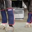 Navy blue and red quilted whitaker 4lw leg wraps with white loni whitaker international ltd label for horse legs