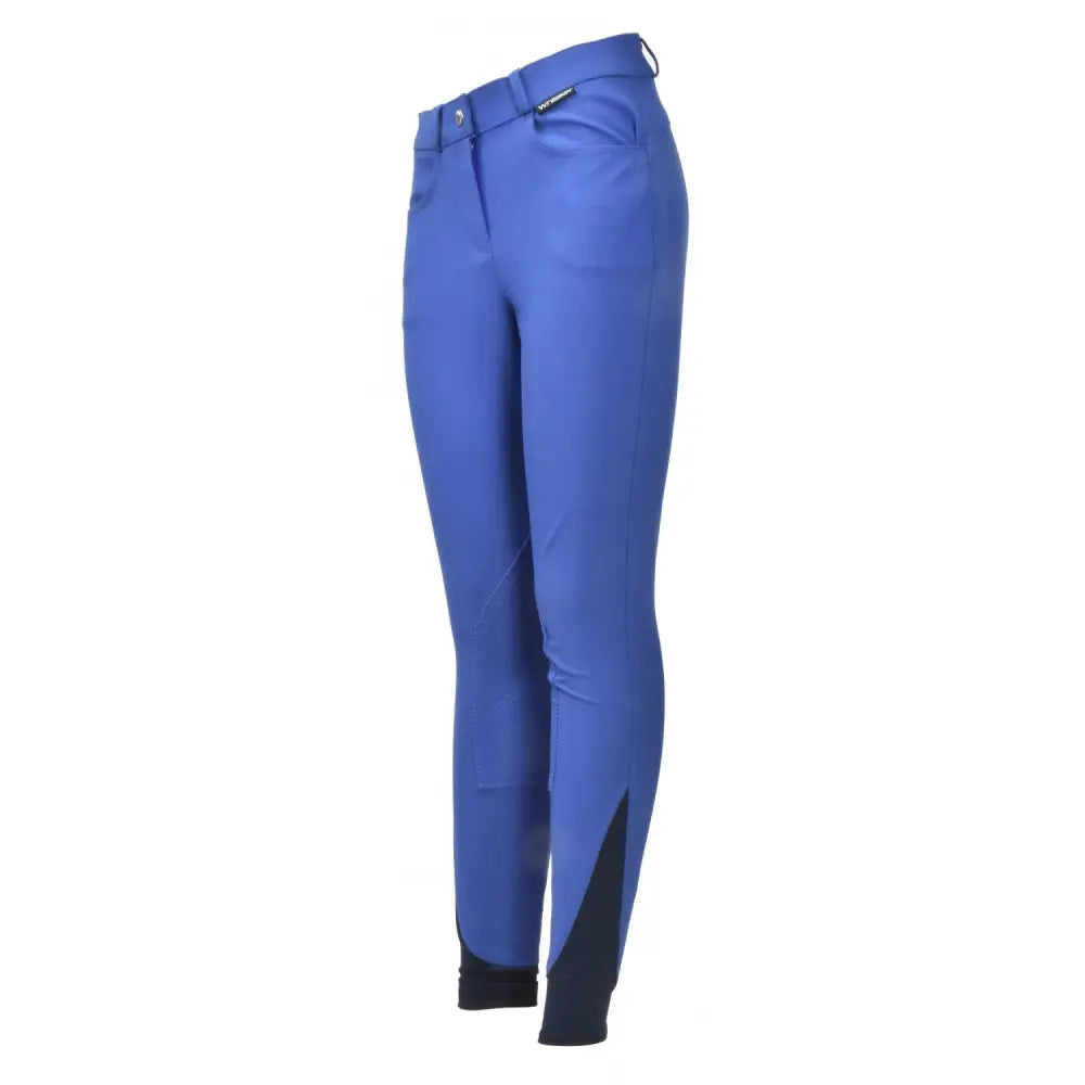 Royal blue whitaker b126k sawley kids breeches with black lower leg accents and subtle brand tag at the waistband