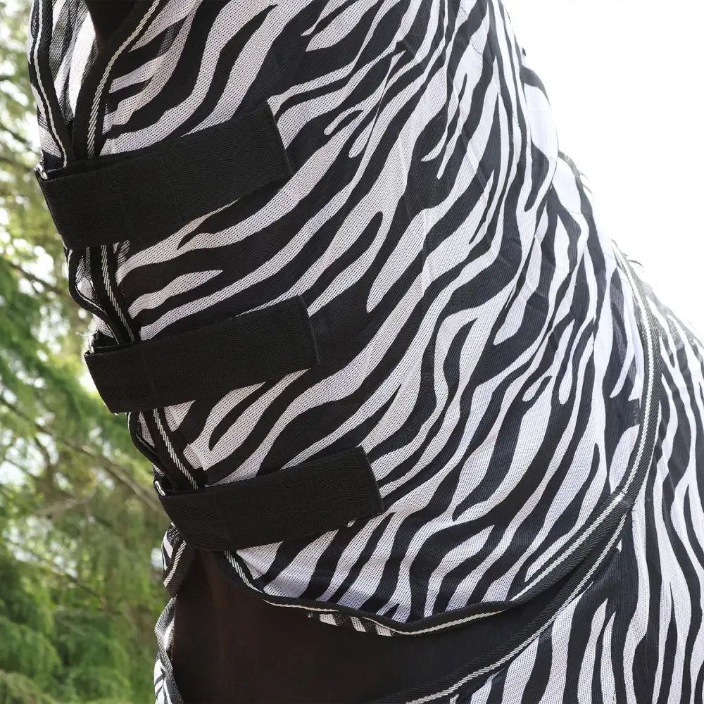 Black and white zebra-striped mesh fly rug zebra with adjustable black elastic straps from whitaker r236 marwell fly rug