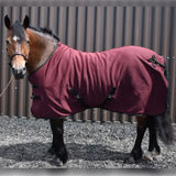 Maroon whitaker r373 bilbao bonded fleece rug with black trim and adjustable straps for horse comfort