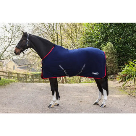 Navy blue fleece rug navy whitaker r470 rastrick with red trim and white branding snug fit over horse body