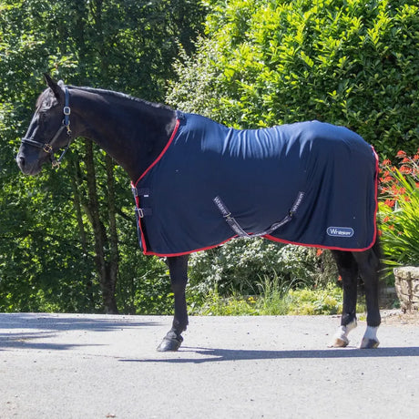 Navy blue whitaker r475 rastrick horse blanket with red trim, t-clip chest fastenings, and belly surcingles