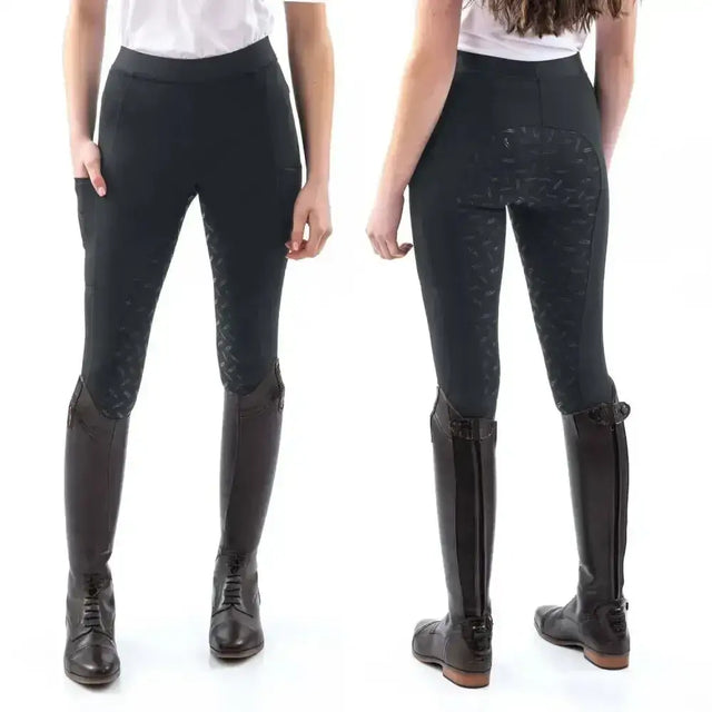 Back view of black whitaker shore riding tights with subtle texture and wide supportive waistband for equestrian use