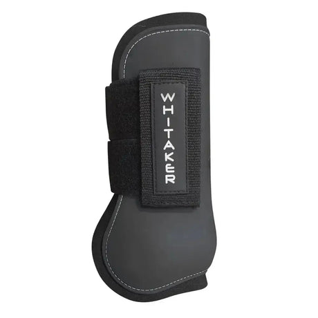 Black whitaker skipton tendon and fetlock boots set with effect pu shell, velcro strap, and white stitching