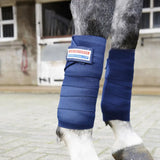 Deep blue ribbed fabric horse leg wrap with branded patch from whitaker tb4 training bandages collection