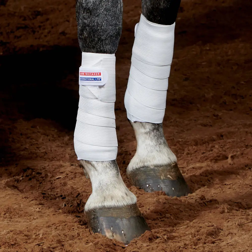 White textured whitaker tb4 training bandages with red and blue bon whitaker international ltd label