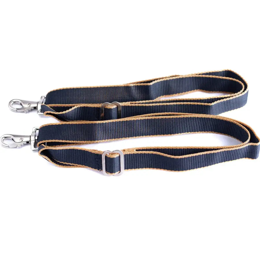 Navy blue woven wicklow leg straps with tan trim and silver metal hardware for horse rug legs