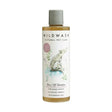 A clear bottle of wildwash buzz off pet shampoo with gray cap and white label featuring a dog illustration contains golden-yellow liquid