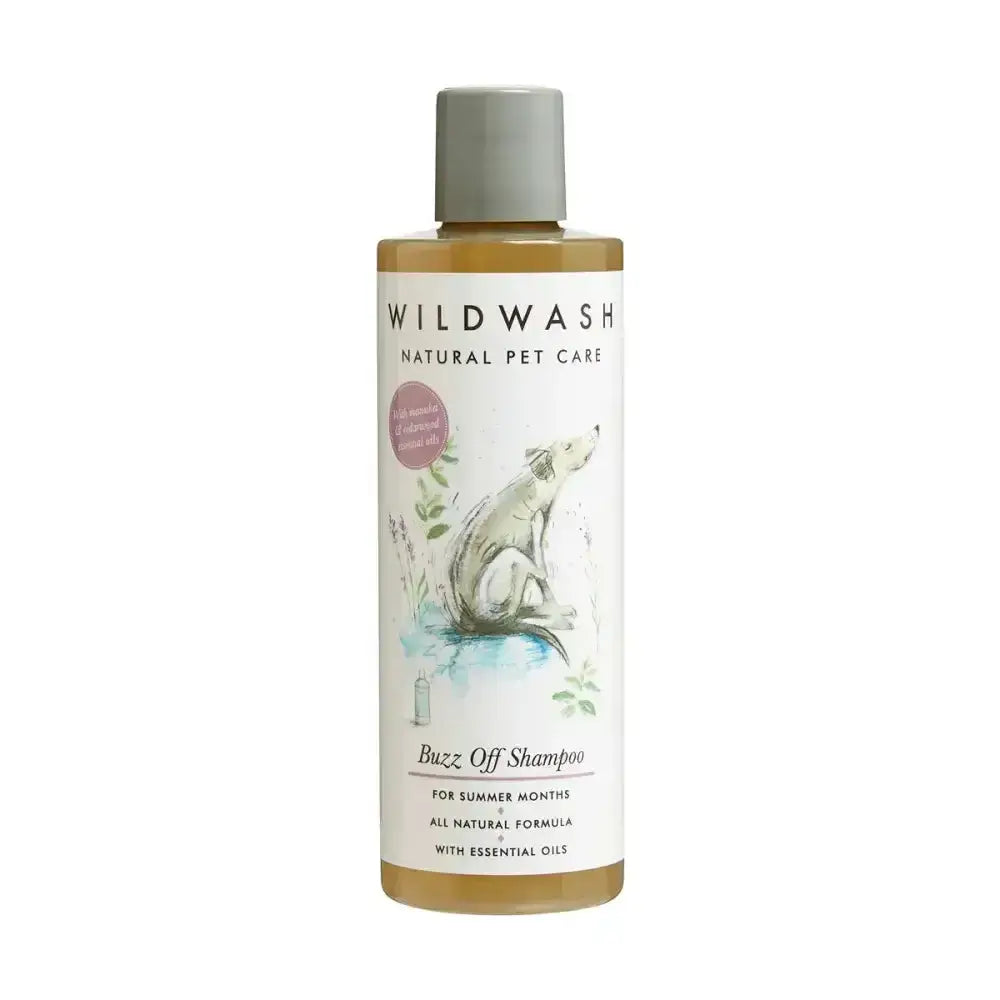 A clear bottle of wildwash buzz off pet shampoo with gray cap and white label showing illustrated dog and golden liquid