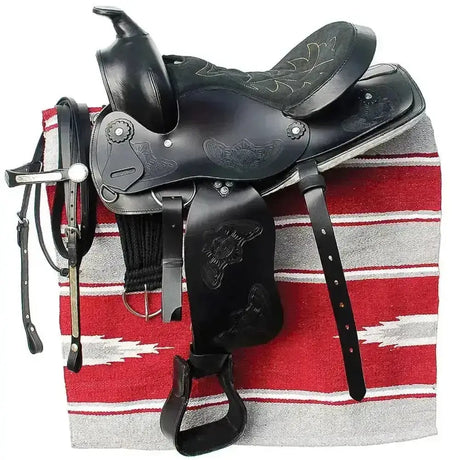 Black leather windsor western saddle with floral animal embossing, silver conchos, and suede seat polished finish