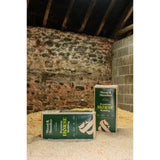 Green and white packaged wood and slumber small flake shavings horse bedding mix in a rectangular bag