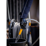 Black waterproof woof wear season yard glove with white logo worn holding yellow hose nozzle over black bucket