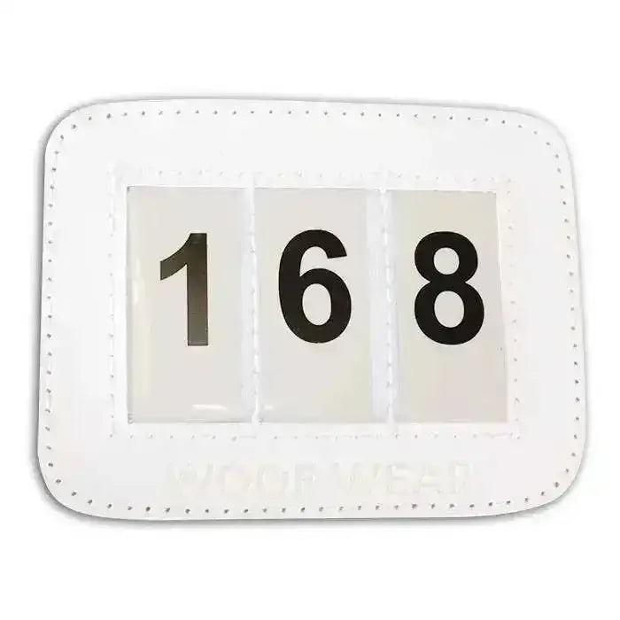 White leather style woof wear bridle number holder with black 168 numerals for competition accessories