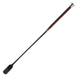 Black riding crop with textured dark reddish-brown grip and silver ferrule in woof wears diamond riding whip design