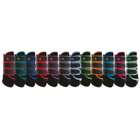 A row of colorful woof wear dressage wraps in pink teal red purple and green with black bases and matching straps