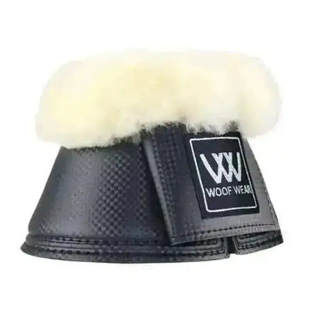 Black carbon-fiber-patterned woof wear faux sheep pro over reach boots with plush white sheepskin lining and brand patch