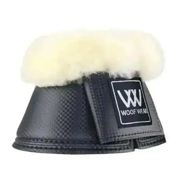 Black carbon-fiber-patterned woof wear faux sheep pro over reach boots with plush white sheepskin lining and brand patch
