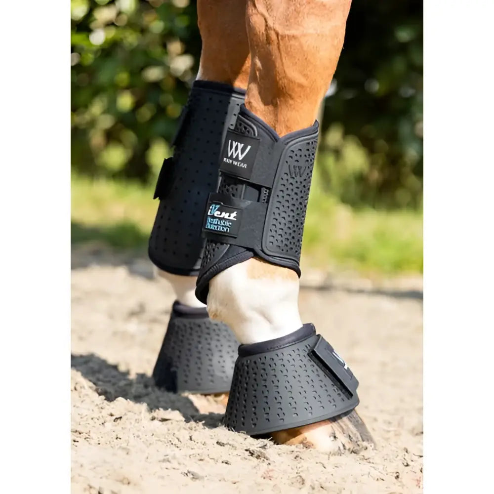 Black perforated woof wear ivent hybrid boot with breathable mesh and adjustable straps showing the back side