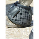 Black perforated woof wear ivent overreach boot with carbon fiber panel designed as a turn overreach boot