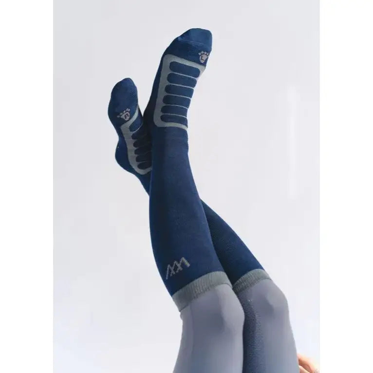Navy blue woof wear long bamboo tech riding sock with gray reinforced panels and subtle logo on foot and ankle