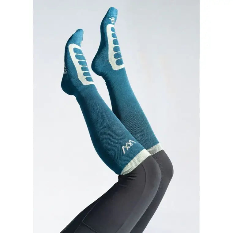 Teal woof wear long bamboo tech riding sock with white grip patterns and subtle logo designed for performance wear