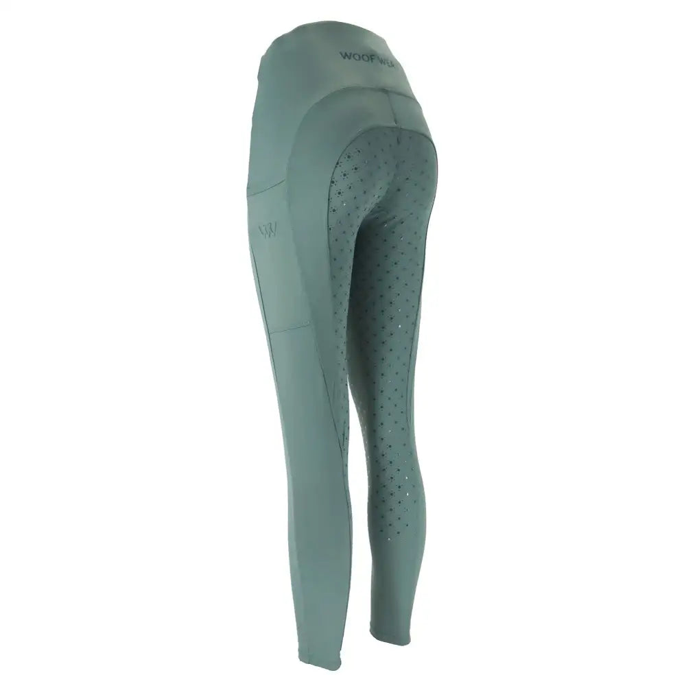 Mint green woof wear original lite riding tights with perforated panels and branded waistband made from iflex fabric