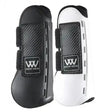 Black and white woof wear pro tendon boots with carbon fiber texture accents and breathable design features