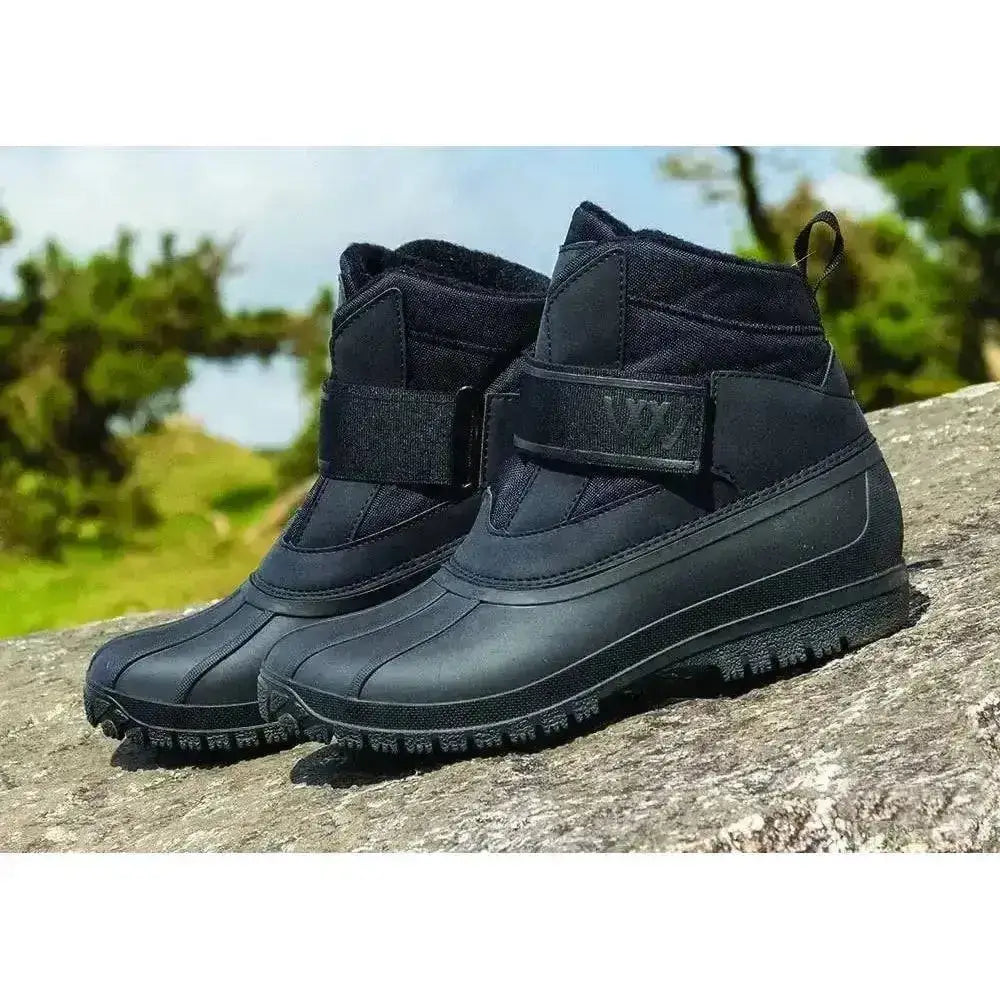 Black woof wear short yard boot junior with waterproof rubber sole and adjustable strap closure for outdoor use
