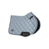 Light gray quilted vision aura saddle pad with black trim and woof wear logo patch for close contact use