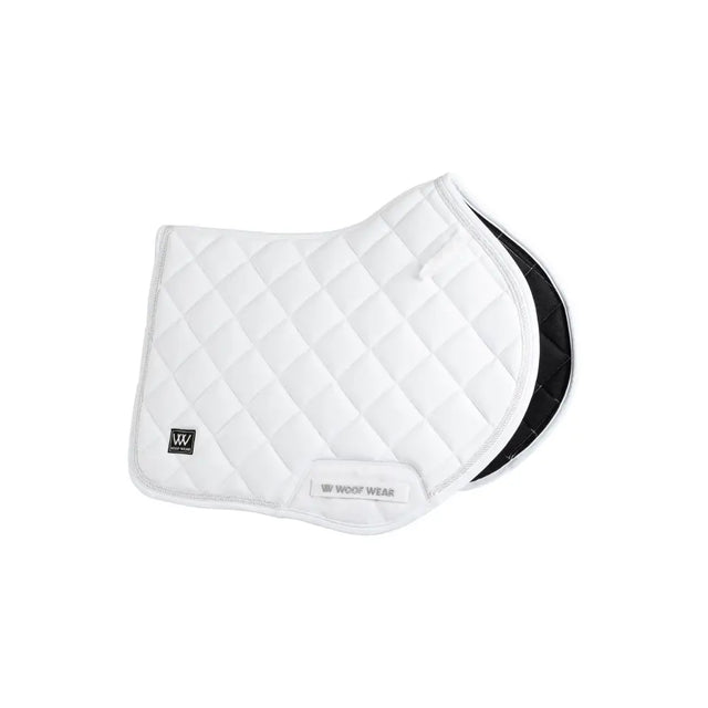 White quilted vision aura close contact saddle pad with black underside and woof wear branding