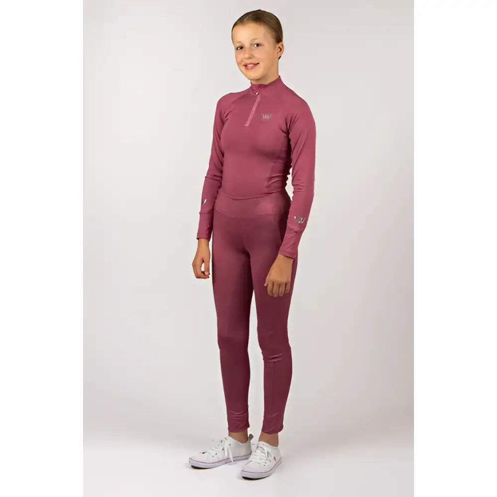 A maroon woof wear young rider tech shirt with a high neck zipper long sleeves made from iflex fabric