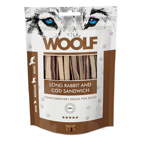 Brown and white packaged dog treats labeled woolf long rabbit cod sandwich featuring a wolf face with blue eyes
