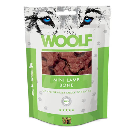 Green and white pouch of woolf mini lamb bone dog treats with a graphic of blue eyed wolf eyes on the front