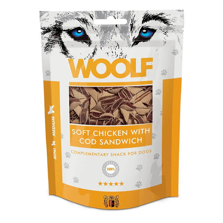 A white and orange bag of woolf soft chicken with cod sandwich dog treats featuring blue-eyed wolf illustration