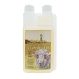 A 500ml translucent plastic bottle of woolskin premium woolskin wash with australian tea tree oil and a sheep image label