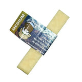 A pale yellow rectangular yak snack chew wrapped in colorful packaging labeled medium for horses and equestrian use