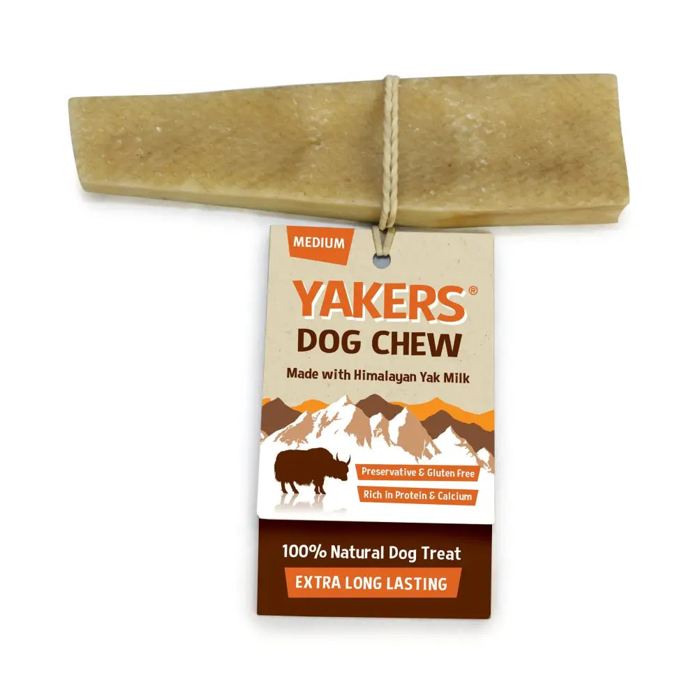 A medium-sized pale tan yakers dog chew made from himalayan yak milk tied to its tag for medium dog treats