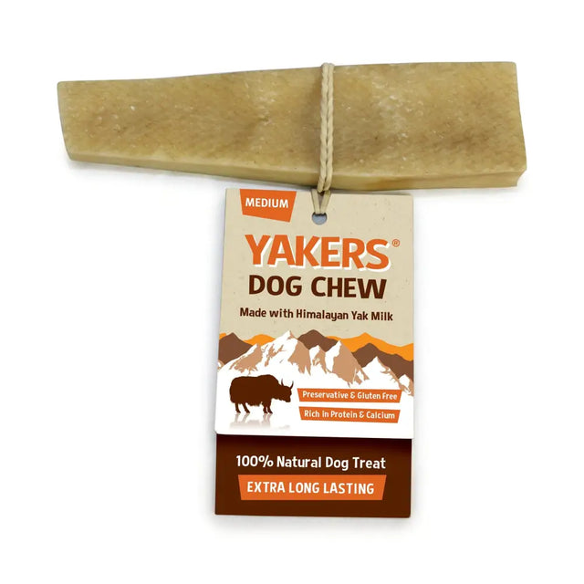 A medium-sized pale tan yakers dog chew made from himalayan yak milk tied to its tag for medium dog treats