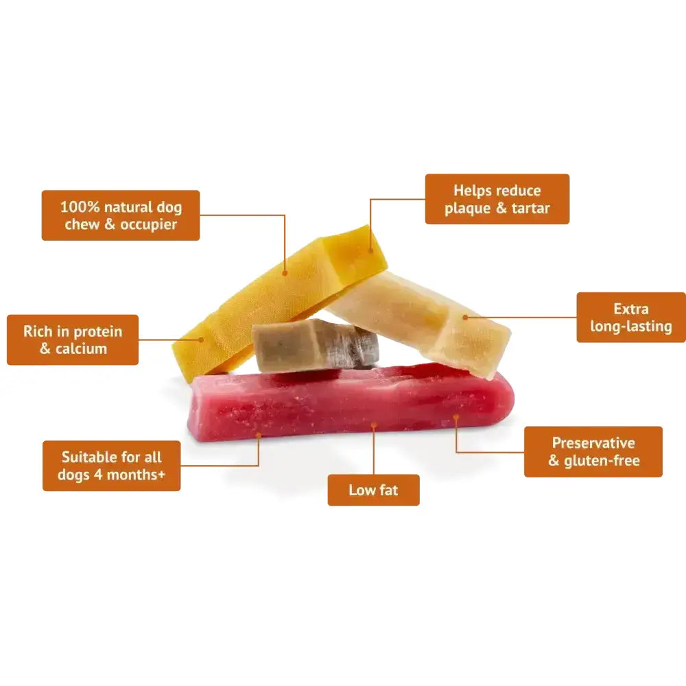 A stack of colorful firm yakers original dog treats in yellow beige and red made from yak milk for chewing fun