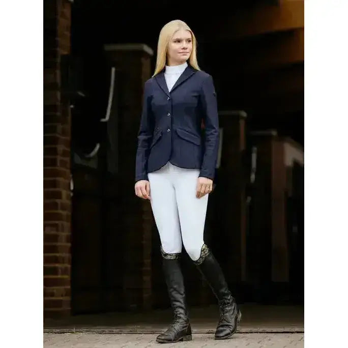 Navy blue young rider kennedy show jacket with three front buttons and flap pockets for equestrian use