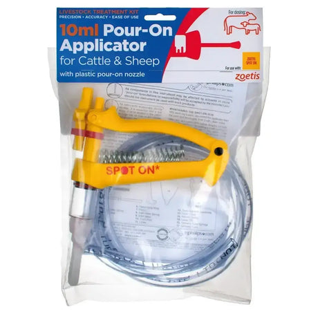 Yellow plastic handled zoetis cattle and sheep pour-on applicator with clear tubing and spring for lice spot-on treatment